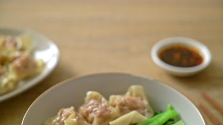 dried egg noodles with pork wonton or pork dumplings without soup Asian food style