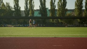 Full length shot city stadium outdoor sport ground arena football pitch soccer field for people training jog run football game badminton court playground summer sports location destination for workout - Powered by Shutterstock - Get 15% off with code: PIKWIZARD15