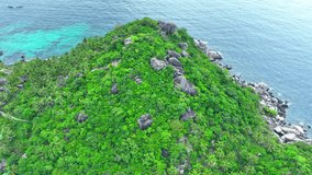 Koh Tao is a haven for thrill-seekers with its rugged coastline, diverse marine life, and world-class diving sites, promising unforgettable adventures under the sea. Flight over the ocean. 4K.
