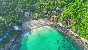 Discover tranquility on Tao Island, where azure waters meet lush landscapes, offering serenity and adventure. Drone aerial view. Stock footage. Tropical sea background. 4K.
