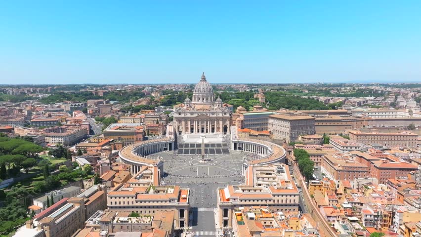 Aerial view of St Peter's Basilica in Vatican City in the city . Rome, Italy.  tourist attraction drone pullback shot.sunny bright day. Royalty-Free Stock Footage #3449386749