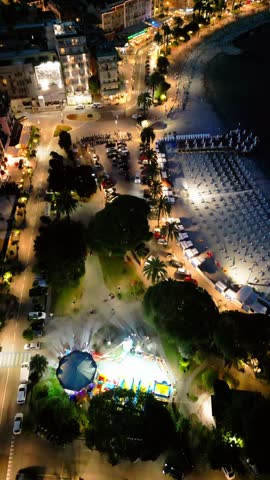 night city lights, city ​​of italy in the light of lanterns, warm light, yachts on the canal, ships in the pier, nightlife, Italy Rapallo