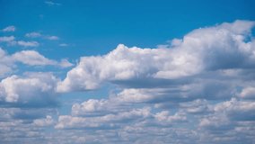 Soft white cumulus clouds slowly move in the blue sky, timelapse. The background of light calm clouds changes shape in cloudy space. Natural background, time-lapse, copy space. 4K - Powered by Shutterstock - Get 15% off with code: PIKWIZARD15
