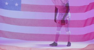 Animation of african american american football player kneeling with ball and flag of usa. American patriotism, sports and competition concept digitally generated video.