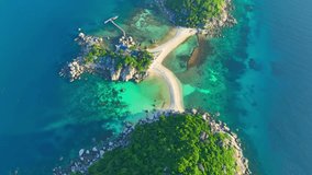 Nangyuan Island offers world-class diving sites with vibrant coral reefs and diverse marine life, thrilling adventurers beneath the waves. Flight over the sea. Stock footage. Koh Nangyuan, Thailand.
