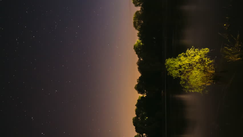 Meditation By The Water. 4k Hyperlapse Meteors Fly Across The Night Sky. Night Sky Above River. From Dusk To Dawn. Stars Float Across Sky. Night Sky Turns Into Morning. Dawn Is Coming. Calmness And