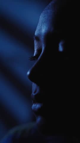 Vertical Close-up face young American black woman feelings loneliness and depression alone in room at home in dark, female pensive sad. Girl has mental problems and insomnia anxiety in solitude.  Royalty-Free Stock Footage #3449512901