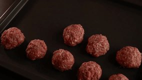  making raw meatballs close up