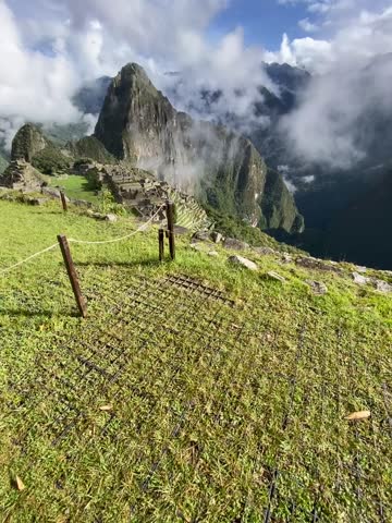 Embark on a visual odyssey with this stunning Machu Picchu video. Explore ancient ruins embraced by breathtaking landscapes. Immerse yourself in the allure of Incan history and natural grandeur. A cin Royalty-Free Stock Footage #3449603693