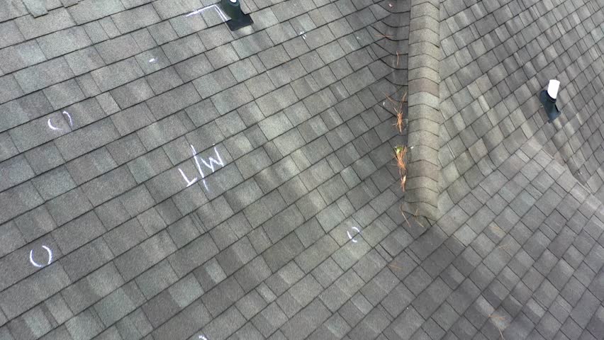 Roof with hail damage and chalk markings from inspection Royalty-Free Stock Footage #3449611901