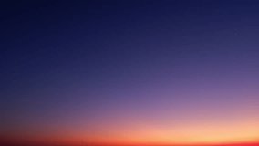 4K : Sunrise sky time lapse - Timelapse video captures a sunrise sky adorned with layers of ethereal clouds, transforming the horizon into a vibrant canvas painted with hues of gold, pink, and orange. - Powered by Shutterstock - Get 15% off with code: PIKWIZARD15