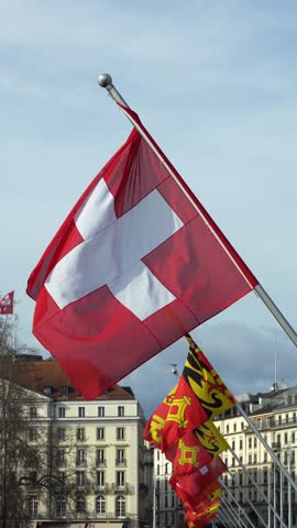 Swiss Flag Waving in Geneva, Switzerland on Mont Blanc Bridge. Vertical Video