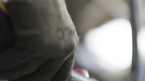 Closeup Of Worker Operating Lifting Crane With Controller, Gloves Covering Hands - Powered by Shutterstock - Get 15% off with code: PIKWIZARD15