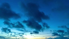 Aerial hyper lapse view amazing cloud moving in blue sky at blue sunrise above the ocean..scenery stunning sky colorful cloud over the islands in Rawai sea Phuket Thailand..Sky texture.