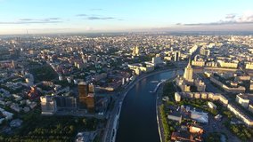 Top view video of Moscow city with buildings roofs and river surface near kremlin, footage of russian capital panorama and landscape during summer day 