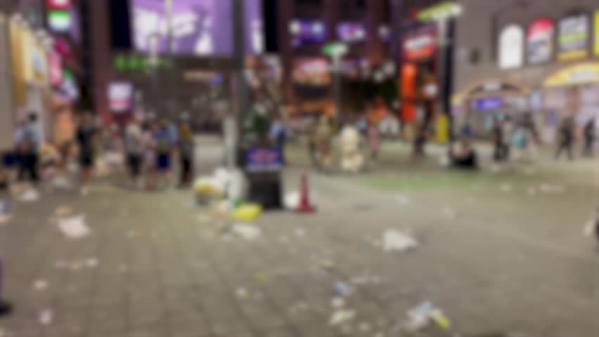 SHINJUKU, TOKYO, JAPAN - AUG 2023 : KABUKICHO, TOYOKO area at night. TOYOKO KIDS (Group of young people, living around Kabukicho after been kicked out or driven from their homes) at the street.