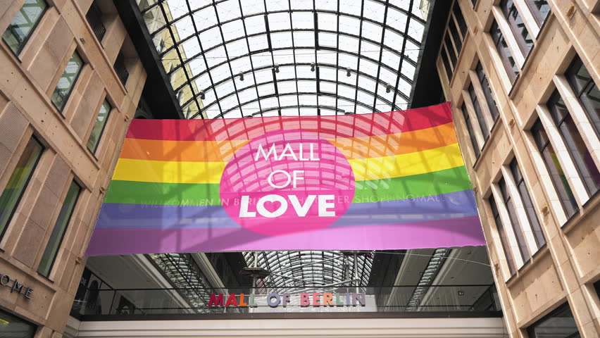 Berlin mall of love. Rainbow flag decoration inside city shop. Vivid lgbt pride symbol. Gay signboard design hang during csd fest. Bi store sign. Lgbtq concept. Art hall style. Christopher street day.