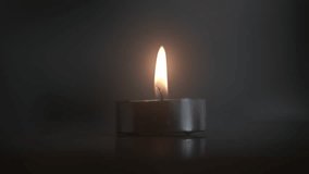Tea Light Candle Flame Flickers Momentarily - Powered by Shutterstock - Get 15% off with code: PIKWIZARD15