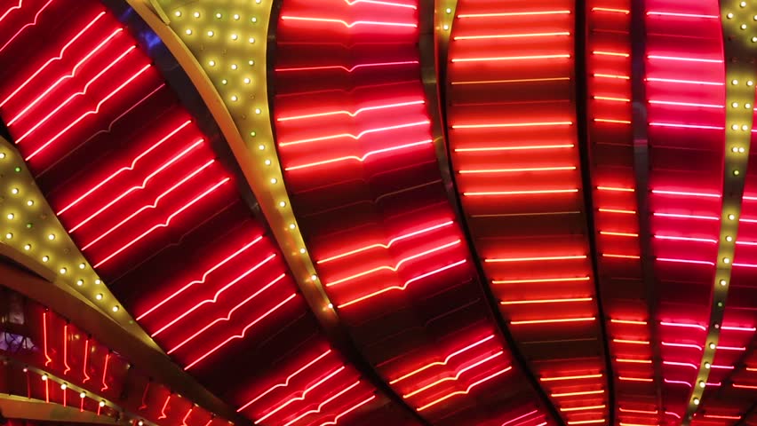 Las Vegas Neon Lights close-up. Neon flashing lights of Las Vegas Casino. Flashing neon light on the famous Las Vegas Strip. Bright night entertainment and advertisement at resort hotel and casino.