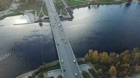 Cars on river Daugava bridge Riga Latvia aerial drone top view view 4K UHD video 