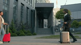 Two business coworkers people Arabian businesswoman meeting in city airport terminal handshaking Indian businessman with luggage baggage trip woman man travel meet handshake greeting shaking hands - Powered by Shutterstock - Get 15% off with code: PIKWIZARD15