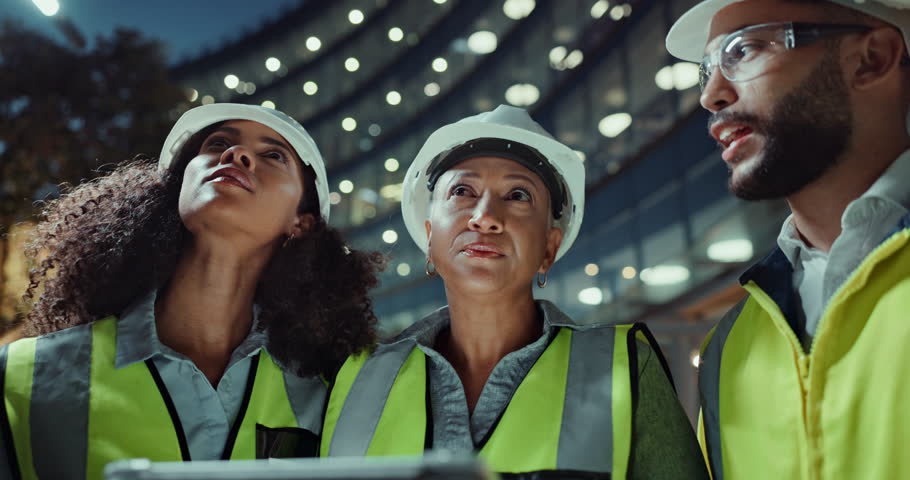 Construction, team and communication by tablet for planning, night and civil engineering or online research in city. Man, women and building app for collaboration and technology for quality assurance