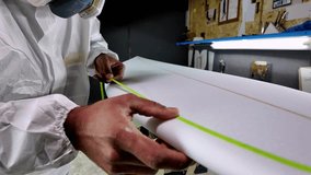 Surfboard manufacturing, Shaper working on board details. Concept of industrial manufacturing, qualified professional, occupation and employment. - Powered by Shutterstock - Get 15% off with code: PIKWIZARD15