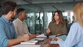 Diverse business team people having discussion at office meeting. International professional executives board group working on corporate financial strategy sitting at conference table and talking. - Powered by Shutterstock - Get 15% off with code: PIKWIZARD15