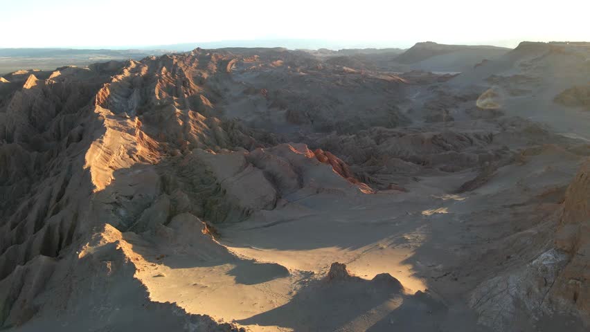 Gliding drone over the "Valle de la Luna" in Atacama, Chile. Slow dance through the arid landscape, capturing the serene beauty of nature's artistry.