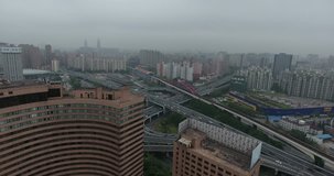SHANGHAI, CHINA – JUNE 2016 : Aerial shot over Central Shanghai highway traffic during daytime