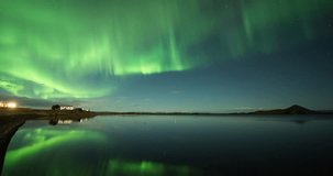 ICELAND – SEPTEMBER 2016 : Amazing timelapse of beautiful northern lights at Lake Myvatn with reflections in water