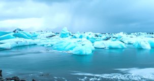 ICELAND – SEPTEMBER 2016 : Timelapse of Jökulsarlón Glacier Lagoon on a cloudy day with icebergs and amazing landscape in view