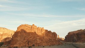 Orange rocks and desert with yellow sand at sunset. Al Ula, Saudi Arabia - Aerial drone view. - Powered by Shutterstock - Get 15% off with code: PIKWIZARD15