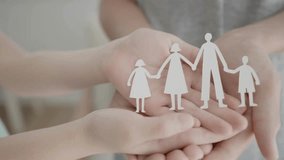 hands vertical video, white paper made family in hand., mental health.
