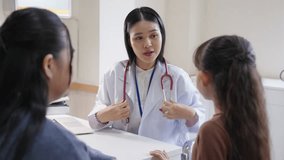 Specialized doctor medical center and hospital health care services concept. General female doctor using stethoscope examining consult illness assessment to little patient girl with mother at clinic. - Powered by Shutterstock - Get 15% off with code: PIKWIZARD15