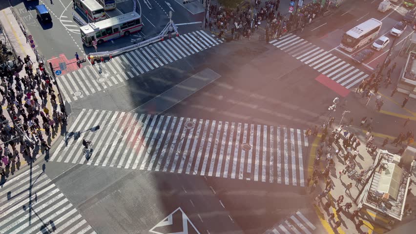 Shibuya Scramble Crossing, commonly known as Shibuya Crossing, is a popular pedestrian scramble crossing in Shibuya, Tokyo, Japan. Royalty-Free Stock Footage #3450750135
