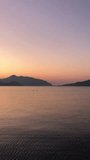 Tourist admiring the sunrise on tropical island - stock video