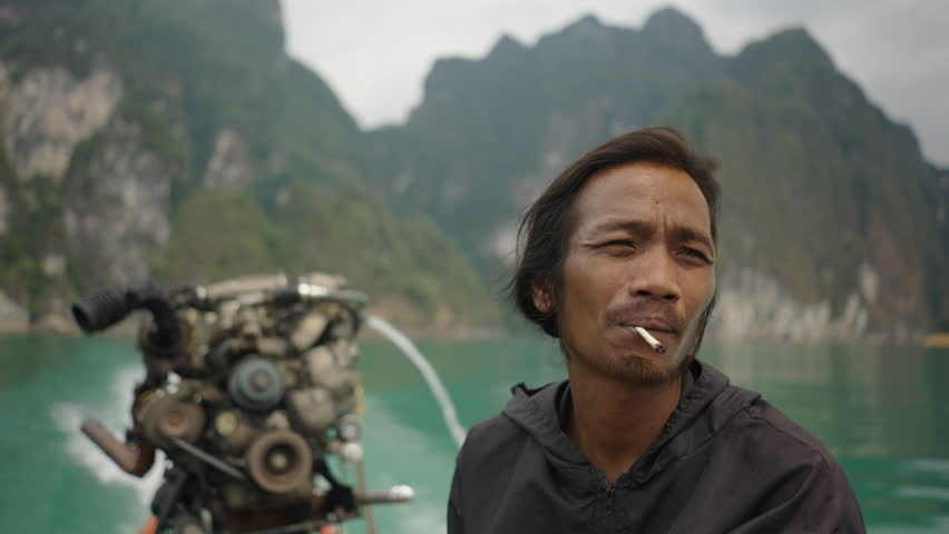 Thai man with a boat engine 