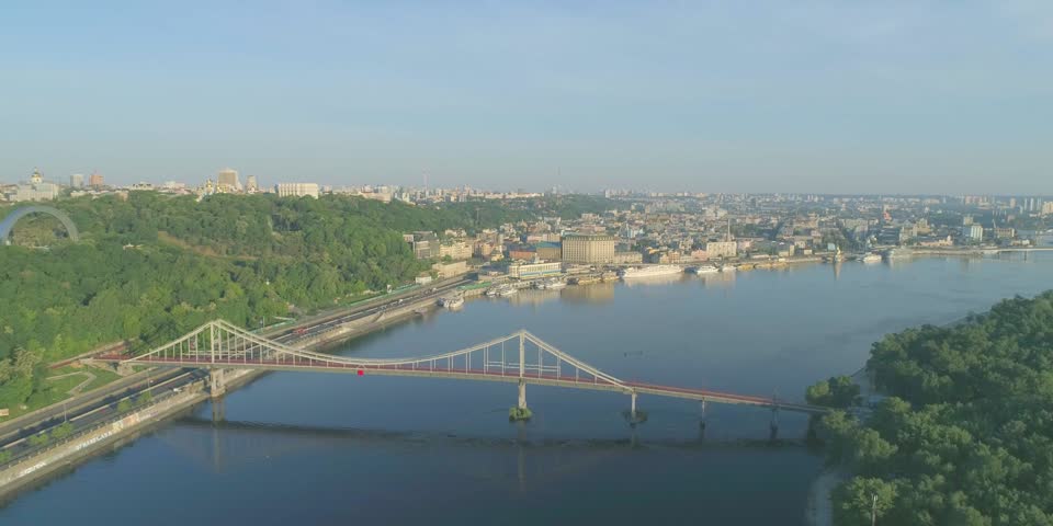 Wide river and car bridge in sun light. Cityscape kyiv ukraine, park and dnepr, dnipro timelapse traffic, fast motion Royalty-Free Stock Footage #3450905937