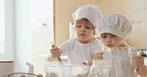 Little Chefs in Training: Boys Mixing Batter Together in Slow Motion
