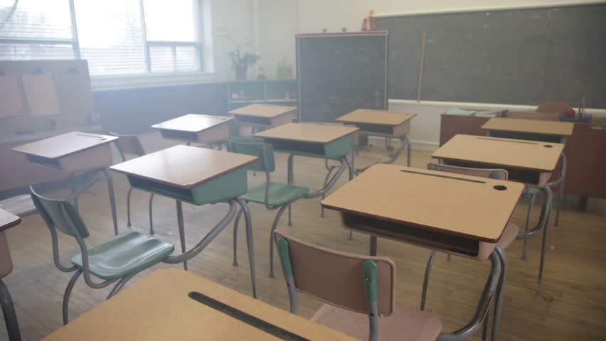 Empty classroom steady shot walking through desks Royalty-Free Stock Footage #3451195165