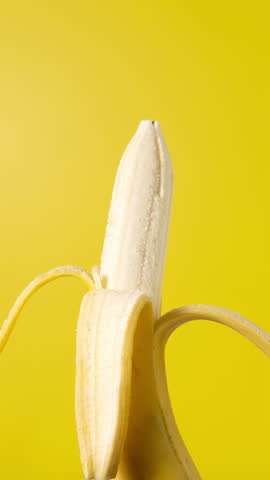 Eating banana on a yellow background. Stop motion animation