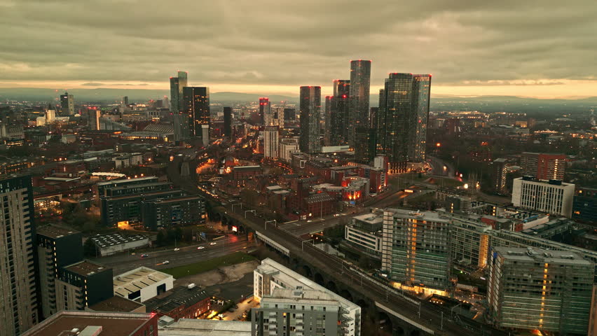 Aerial drone shot across Manchester shot from the west looking east at Deansgate Square, Manchester, UK