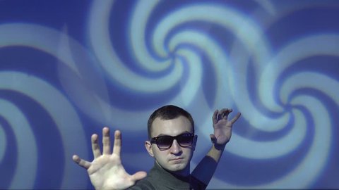 Hypnotist brainwashing the viewer into a deep subconscious subliminal trance using mind control tactics. NLP. Blue and white hypnotic whirlpool shape on background