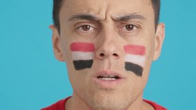 Man with egyptian national flag upset with a referee