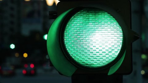 Green Traffic Light at Night. Close-Up.