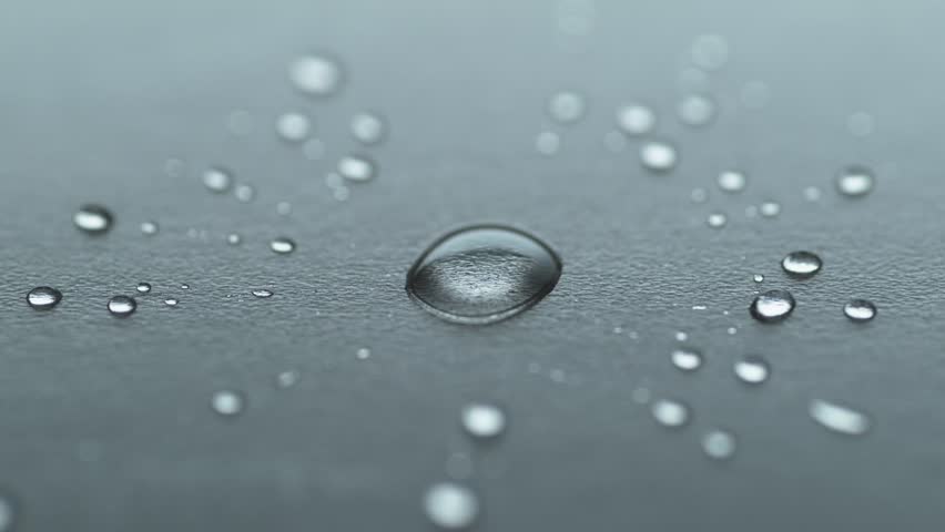 Water Droplets Splashing On Black Surface 