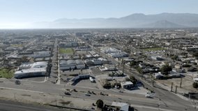 Highway next to Coachella, California with with in background and drone video wide shot panning.