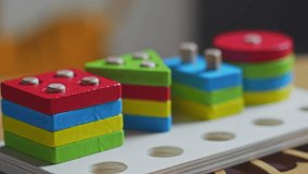 Hands skillfully manipulate colorful construction pieces, crafting amazing shapes and structures. Perfect video for inspiring creativity and play.