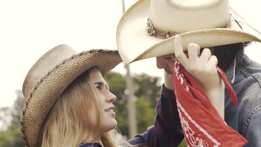A cowgirl kisses her boyfriend at the ranch-4K